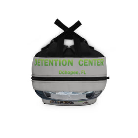 Gray and black container with 'Detention Center Ochopee, FL' text on a white background